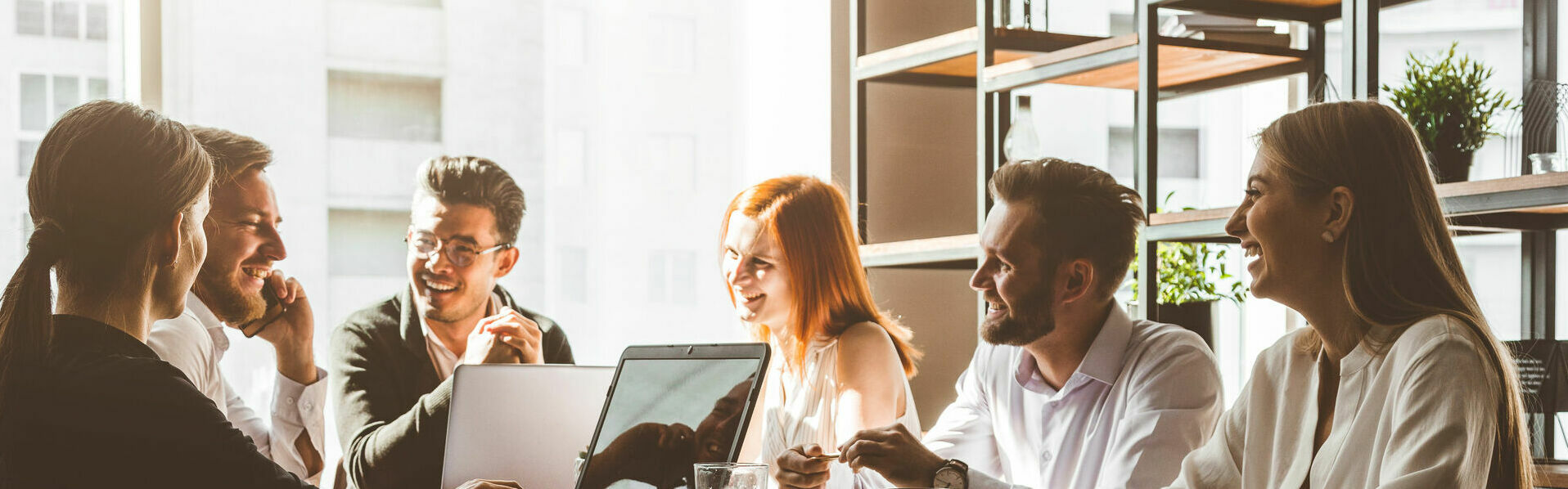 A team of young businessmen working and communicating together i